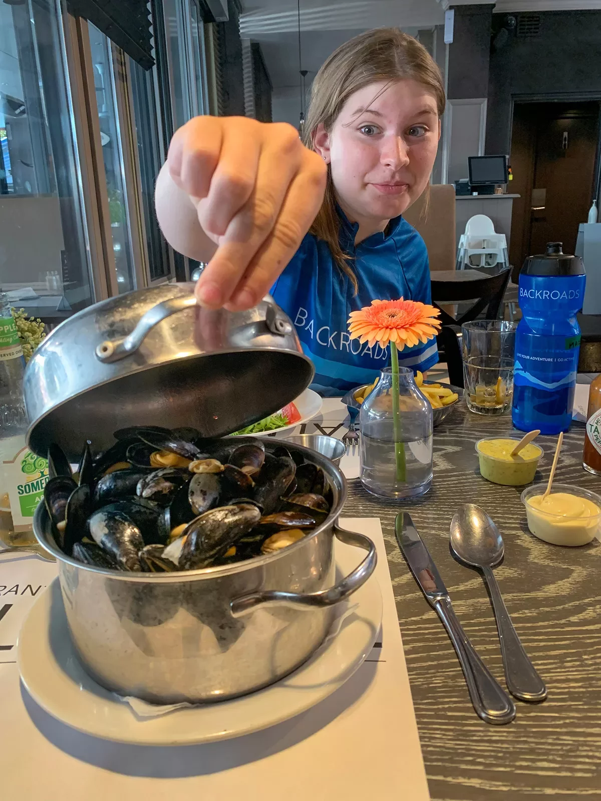 Guest opening a pot of mussels