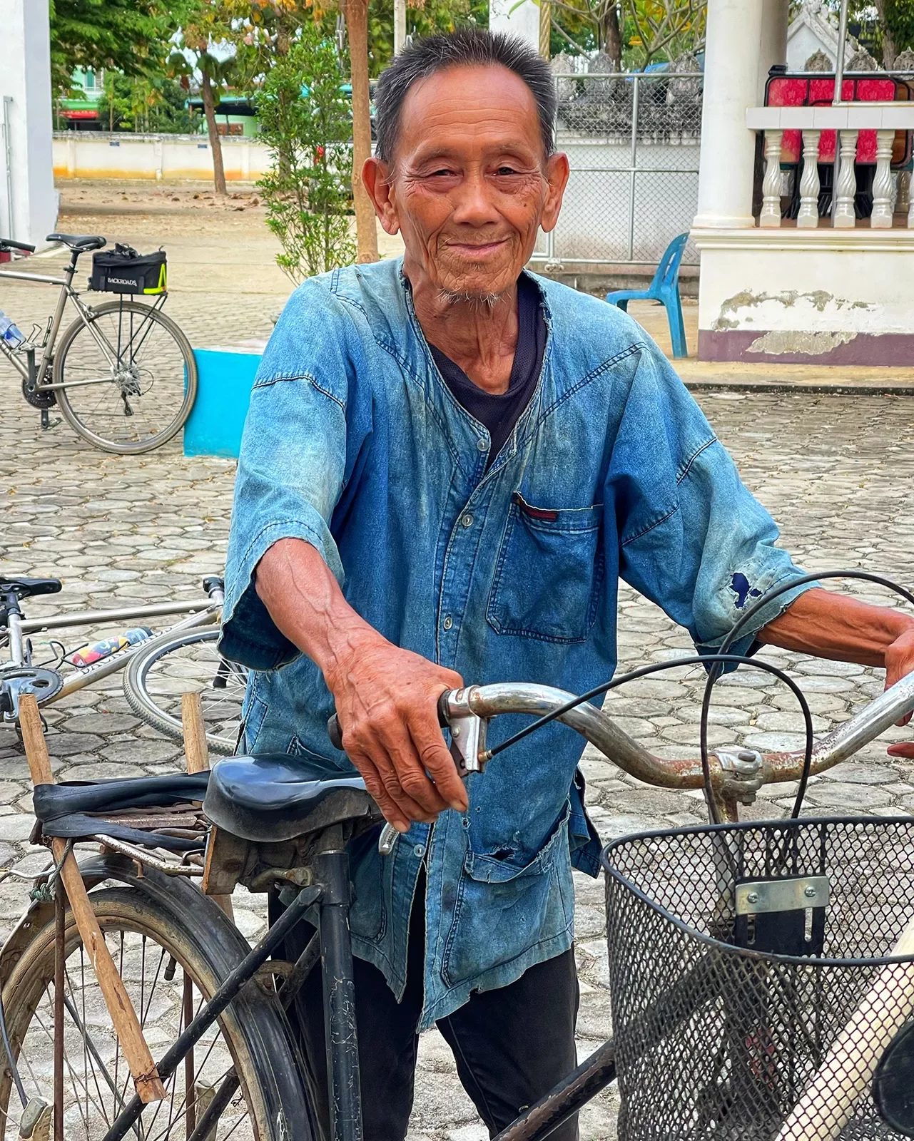 Local Thai man with a bike