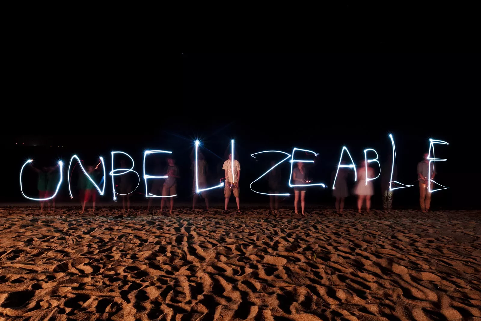 &quot;Unbelizeable&quot; Written by Flash Lights on Beach at Night