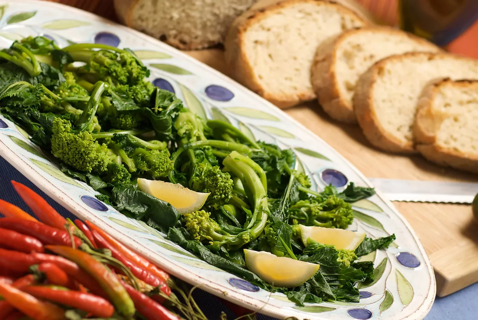 Platter of broccolini, chilis and bread.