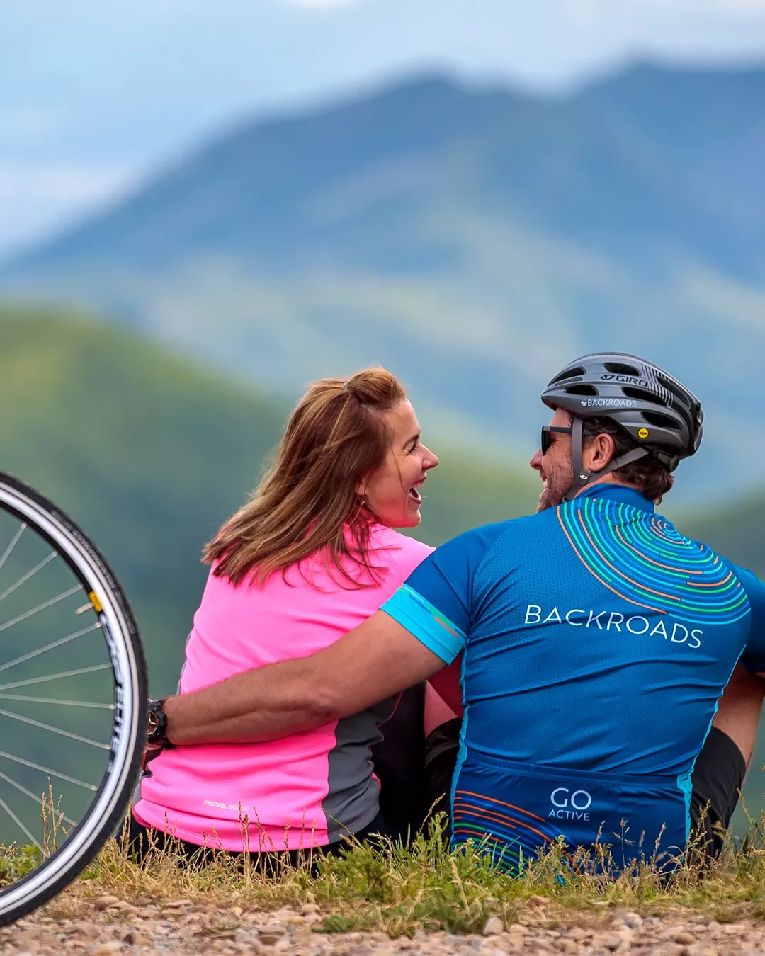 Backroads guests embracing one another after bike ride