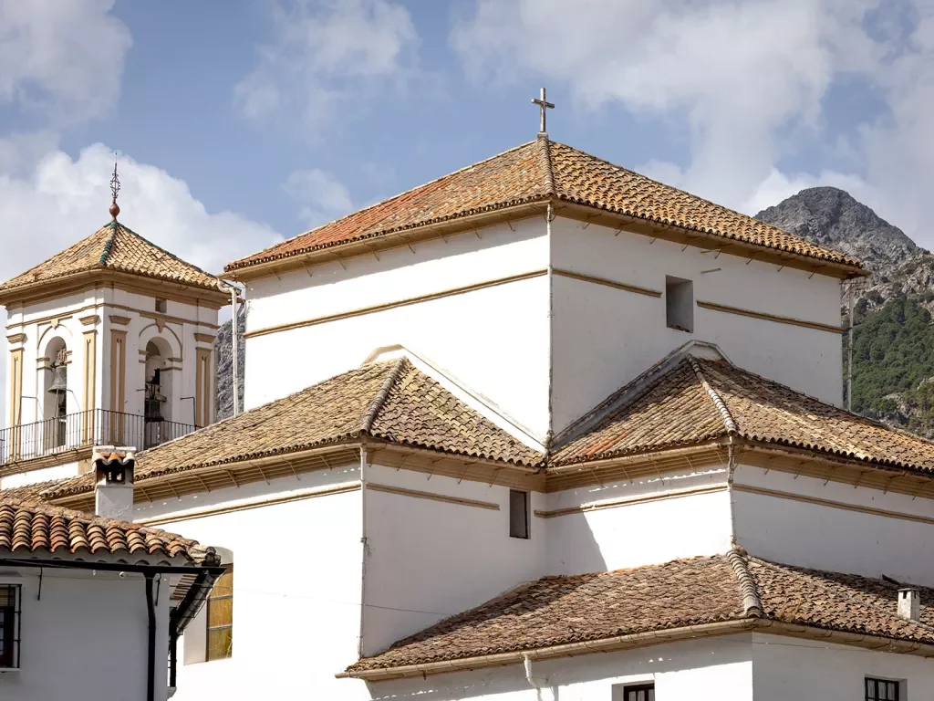 White Spanish buildings with red tile roofs.