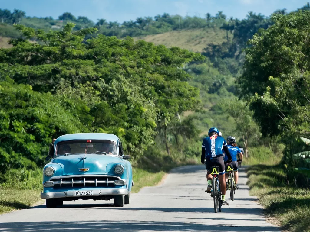 Cycling Past Classic Car