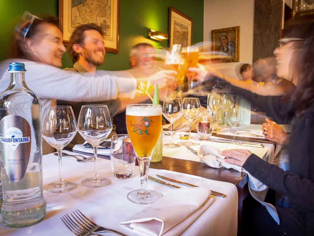 Guests raising a glass at dinner