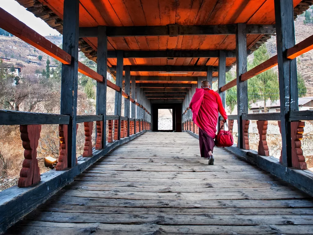 Monk walking along a corridor in Bhutan