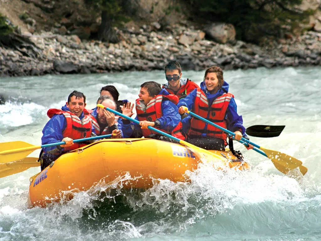 Family rafting down a river in Canada