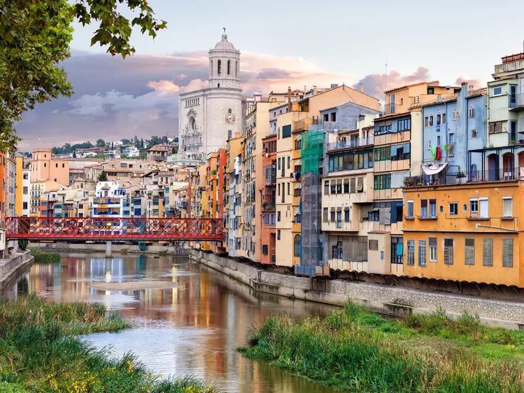 Wide shot of Onyar River running through Girona and it's colorful buildings.