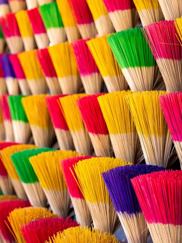 colorful incense stacked in bundles