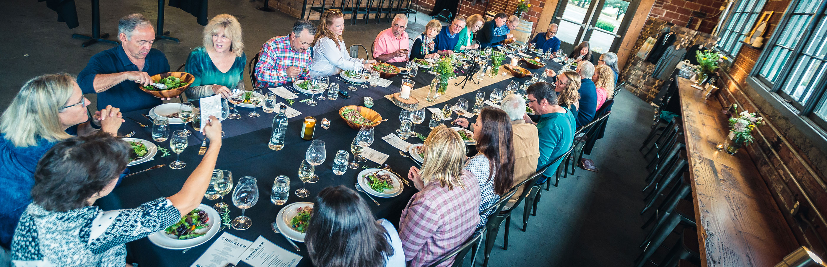 People dining at a long table