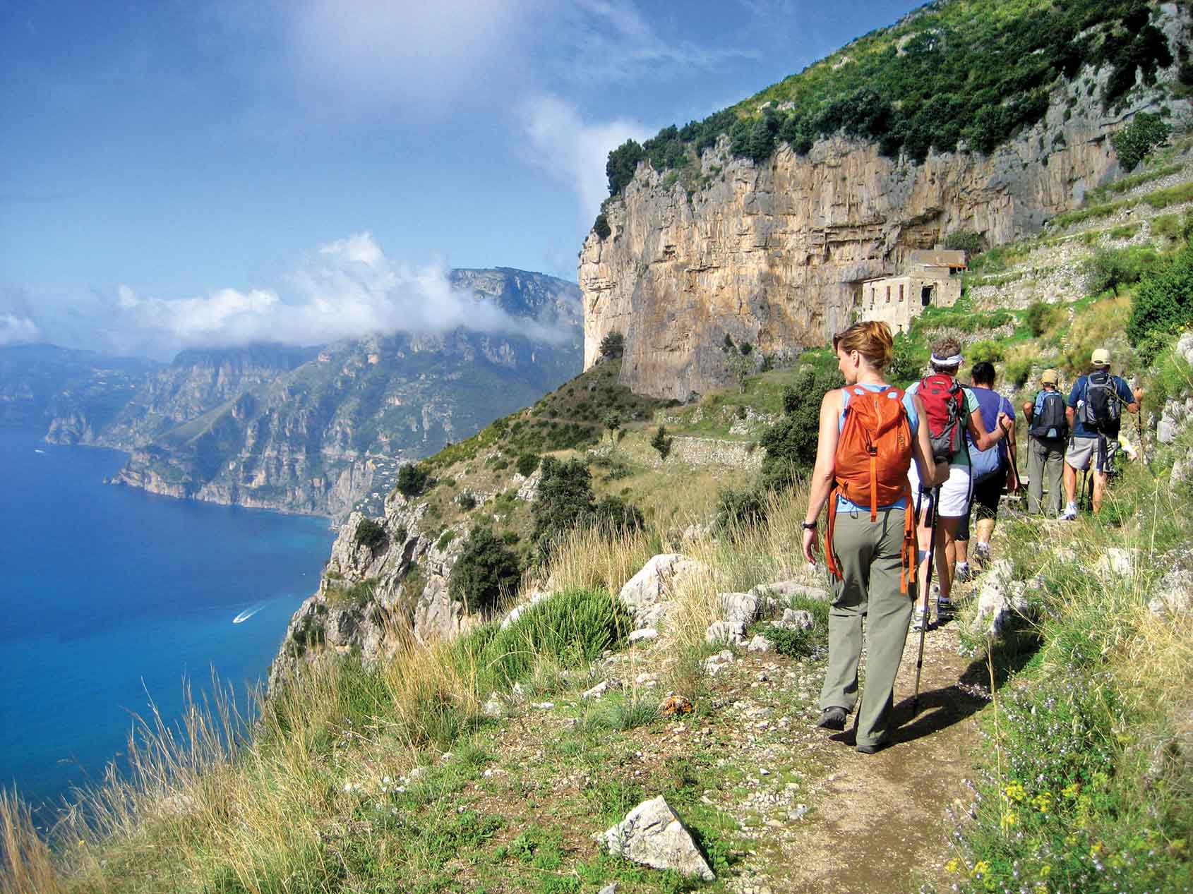 Hiker on a coastal cliff trail