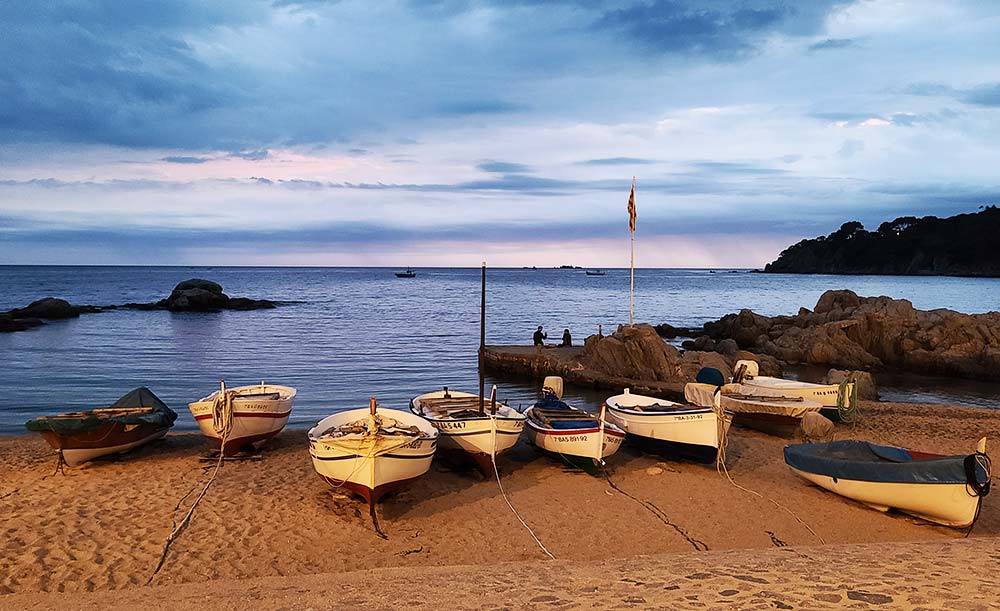 Pyrenees to Costa Brava Bike Tour - Boats at sunset