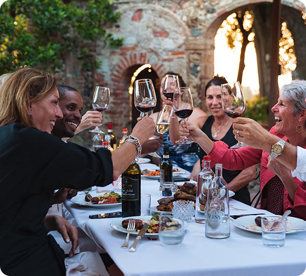 Group of travelers toasting with wine
