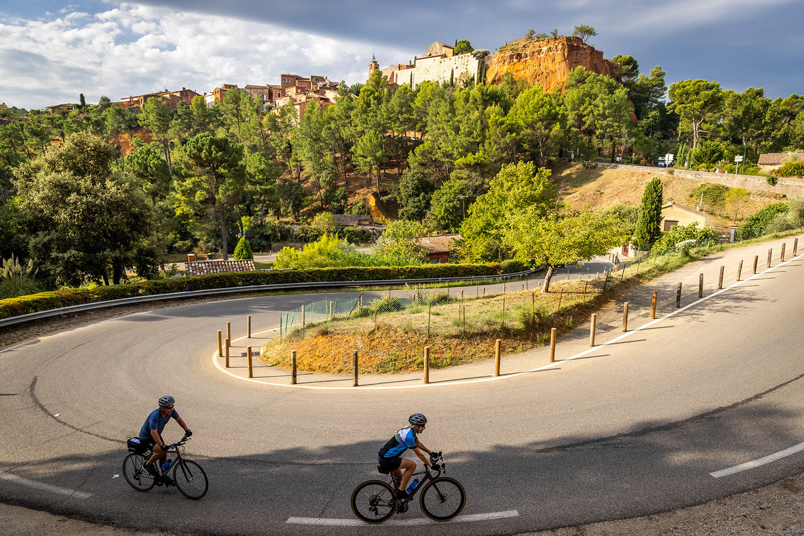 Guests cycling towards hilltop castle.