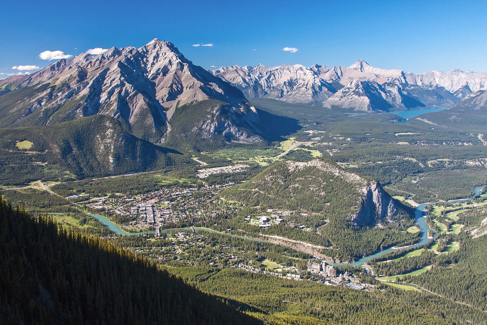 Bird's eye shot of Banff among the mountains.