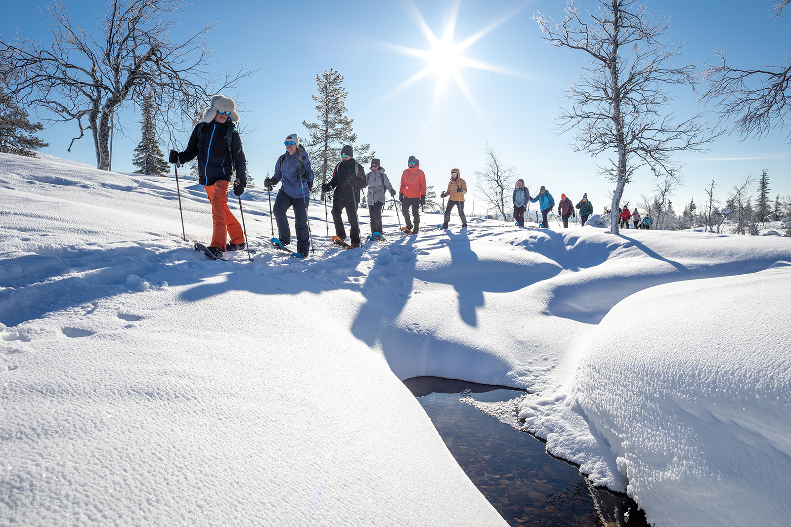 Group Snow Shoeing Creek Iceland