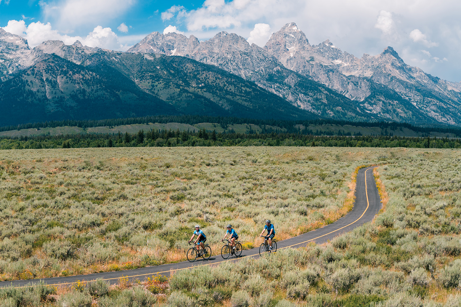Backroads guests riding through green fields