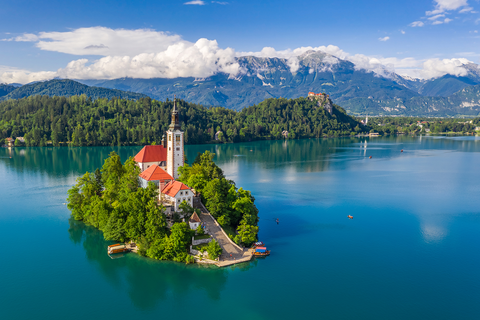 Church on island in center of blue lake.