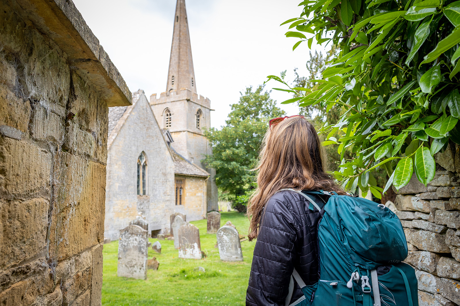 Backroads guest visiting English graveyard.
