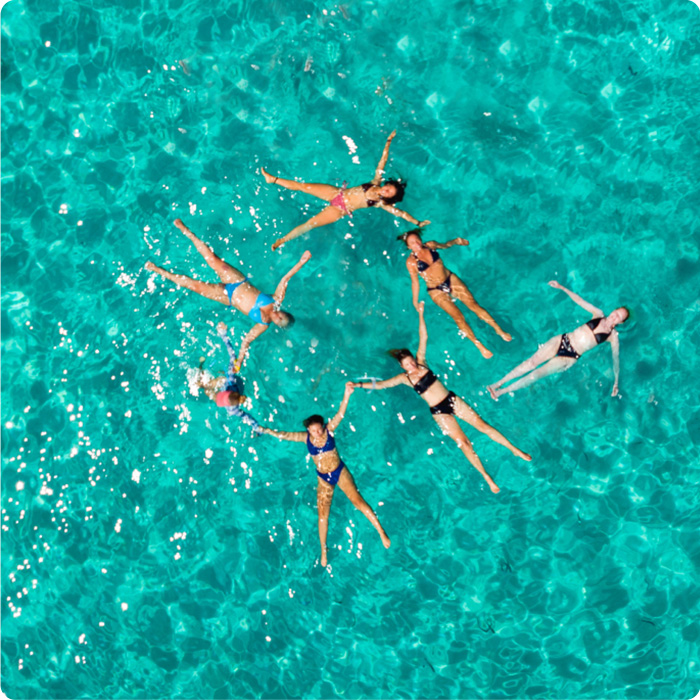 Group of women floating together in the Mediterranean sea