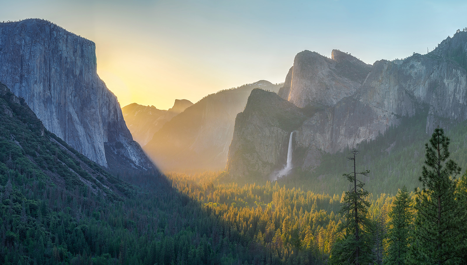 Wide shot of mountains at sunset.