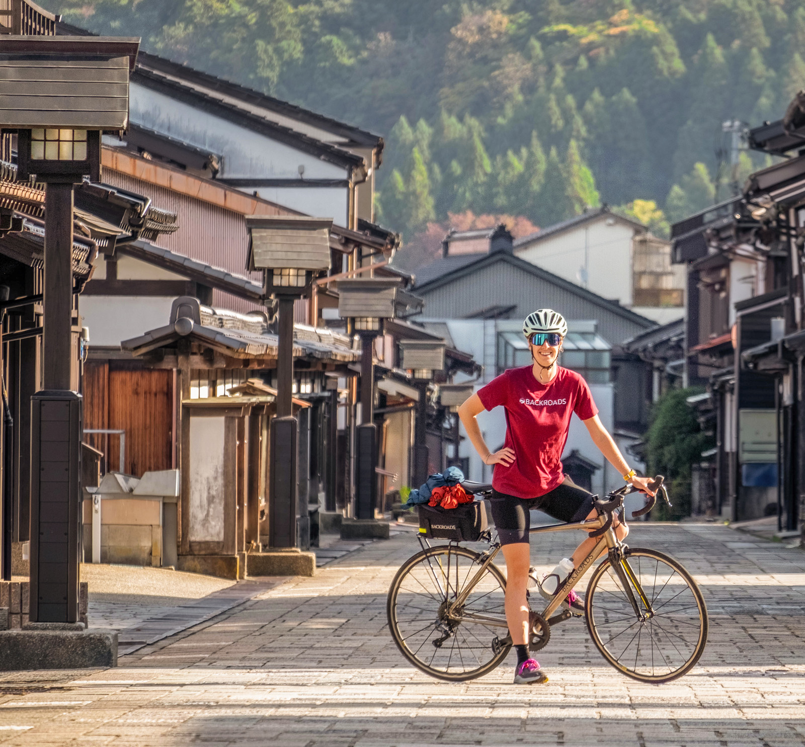 Cyclist posing in a suburban street