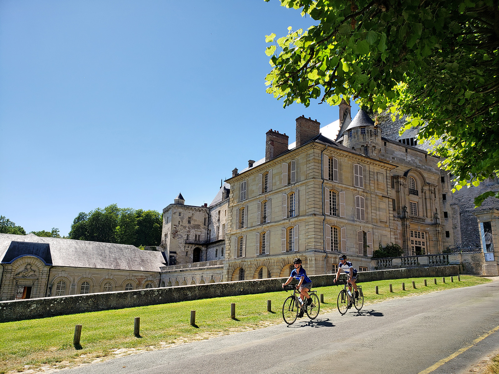 Backroads Guests Biking Past Castle