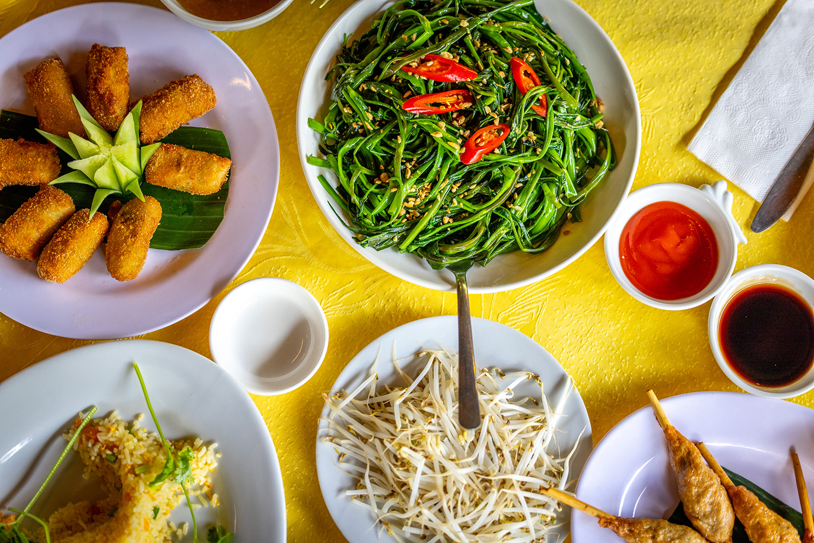 aerial view of overflowing plates on a dinner table