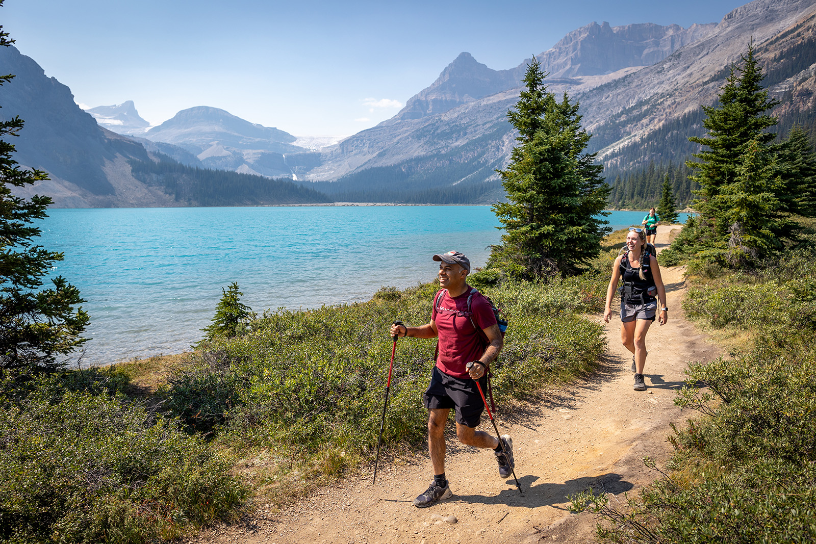 hikers walking by a lake