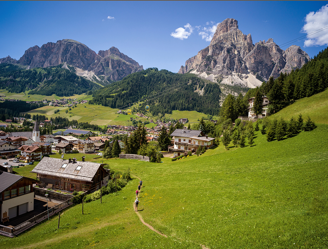 Grassy hillside leading to a small town