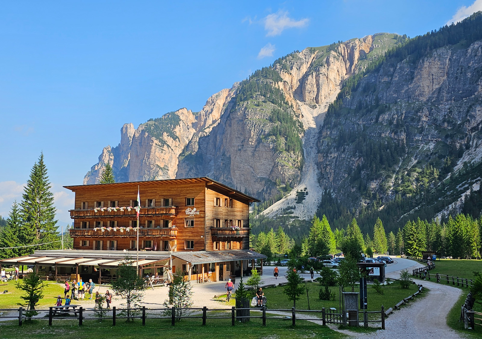 Wooden lodge building with a large mountain in the background