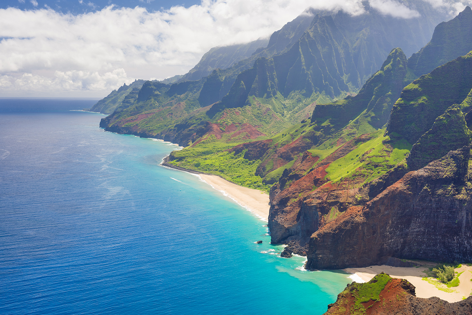 Beach coast with tall mountains in the background