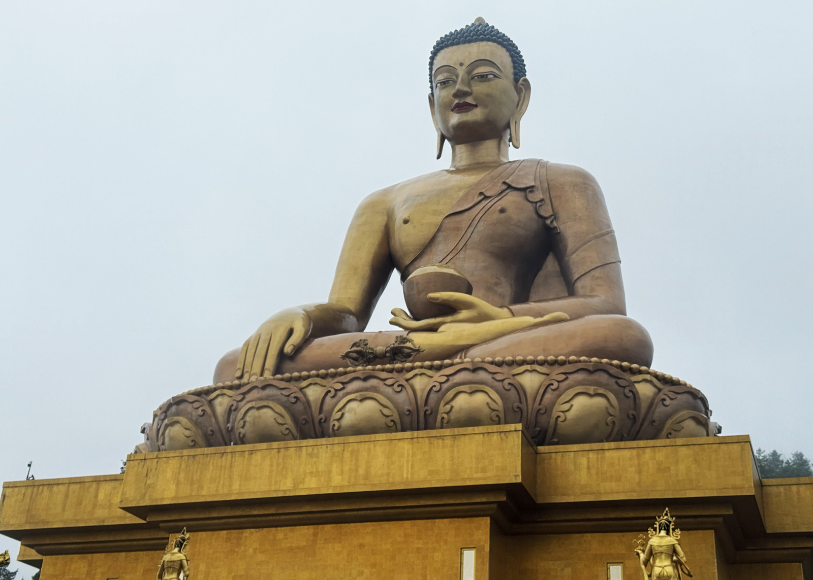 Buddhist statue with a cloudy sky