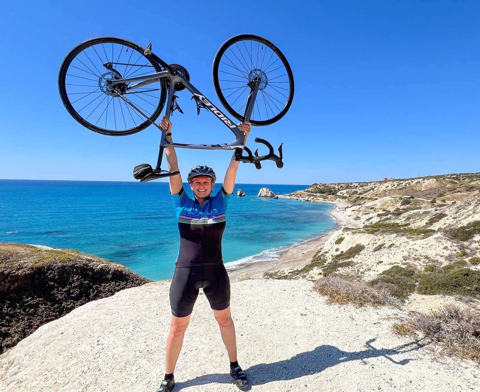 Backroads leader celebrating after a long climb on the island of Cyprus.