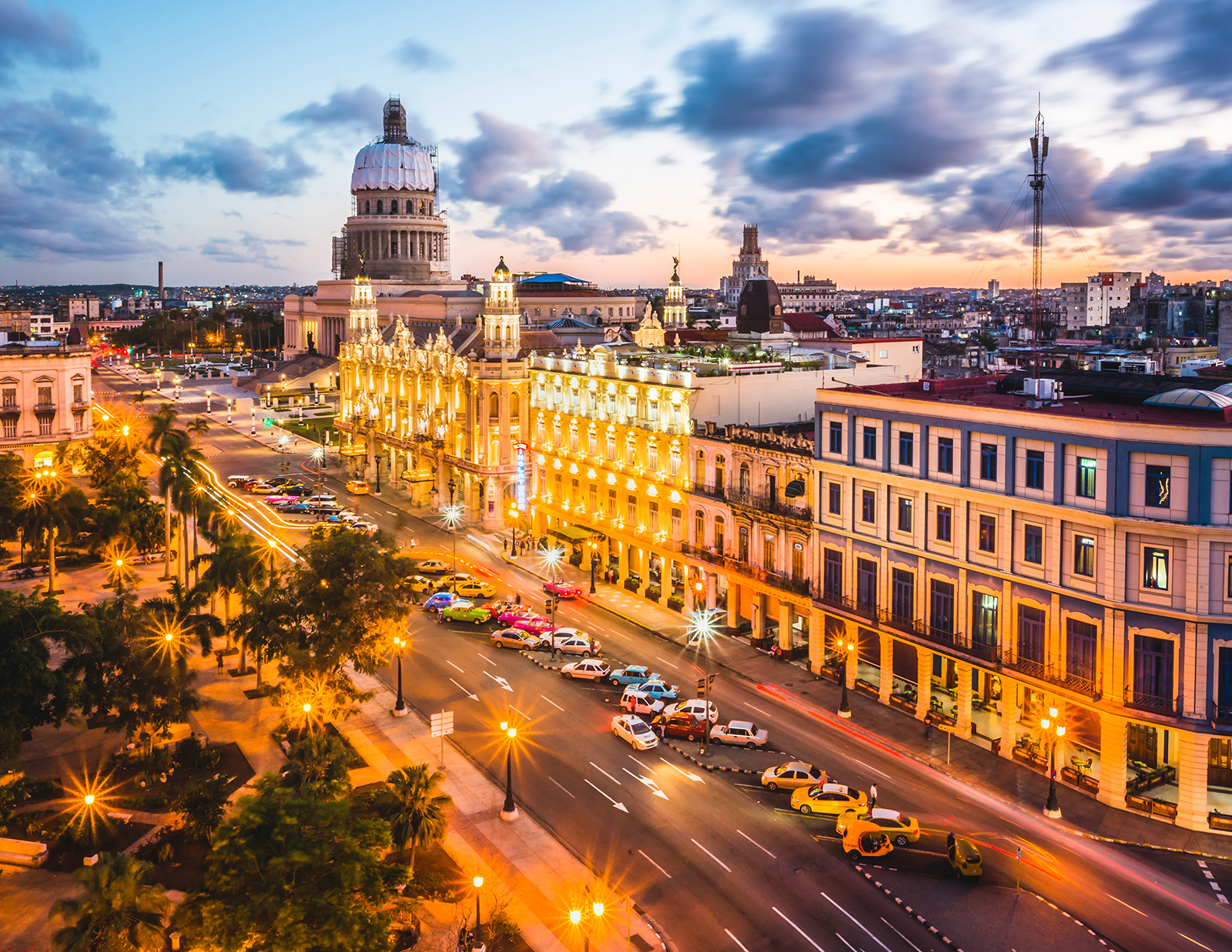 Exterior view of a town streets, illuminated by street lights