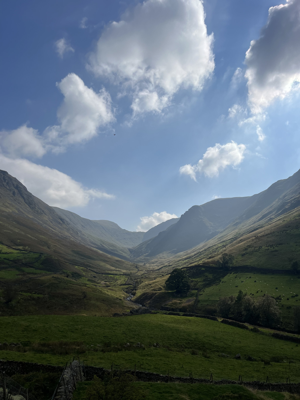 Large valley of hills and cloudy skies