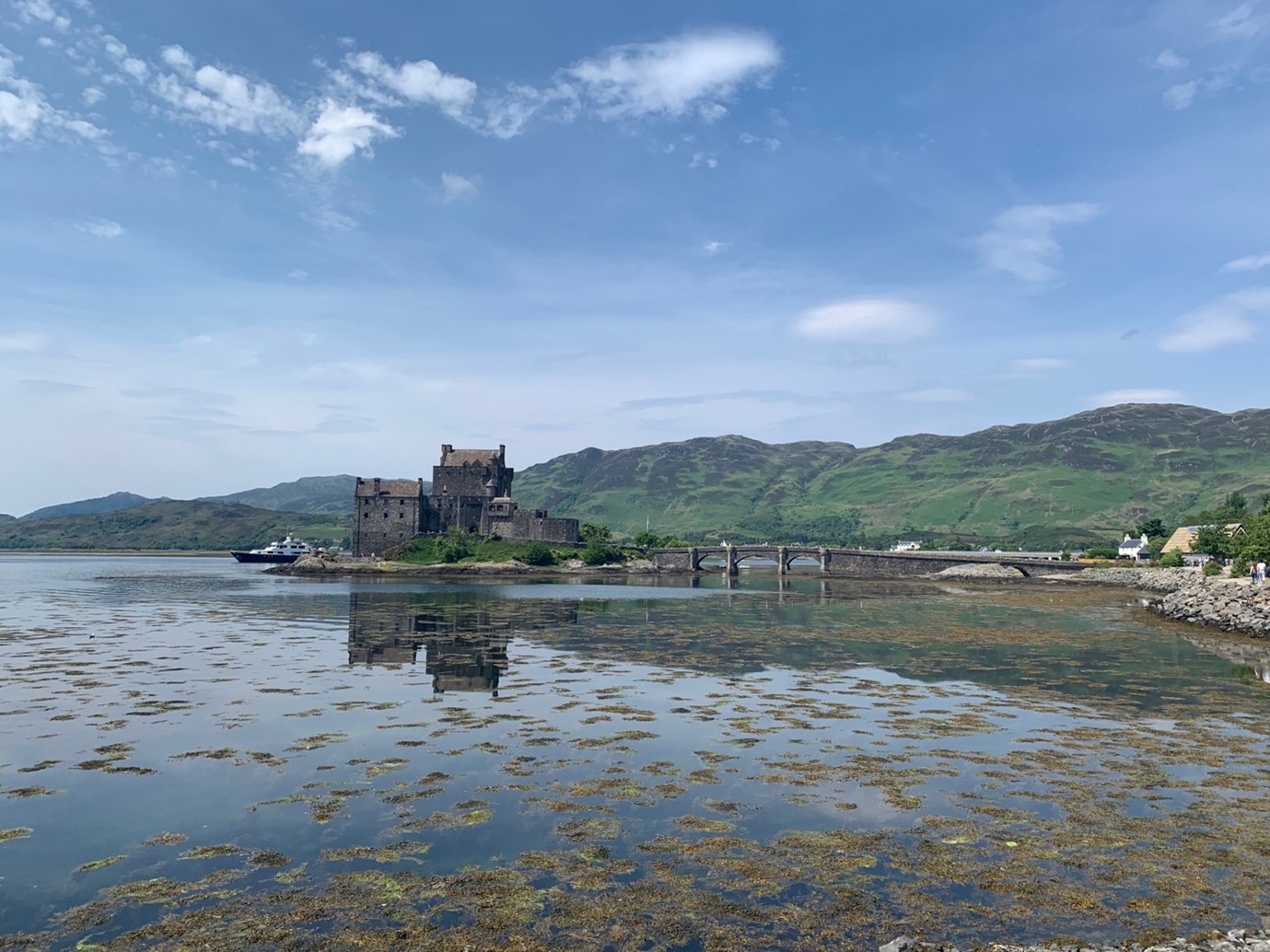 Shallow lake with a stone, castle-like building in the center