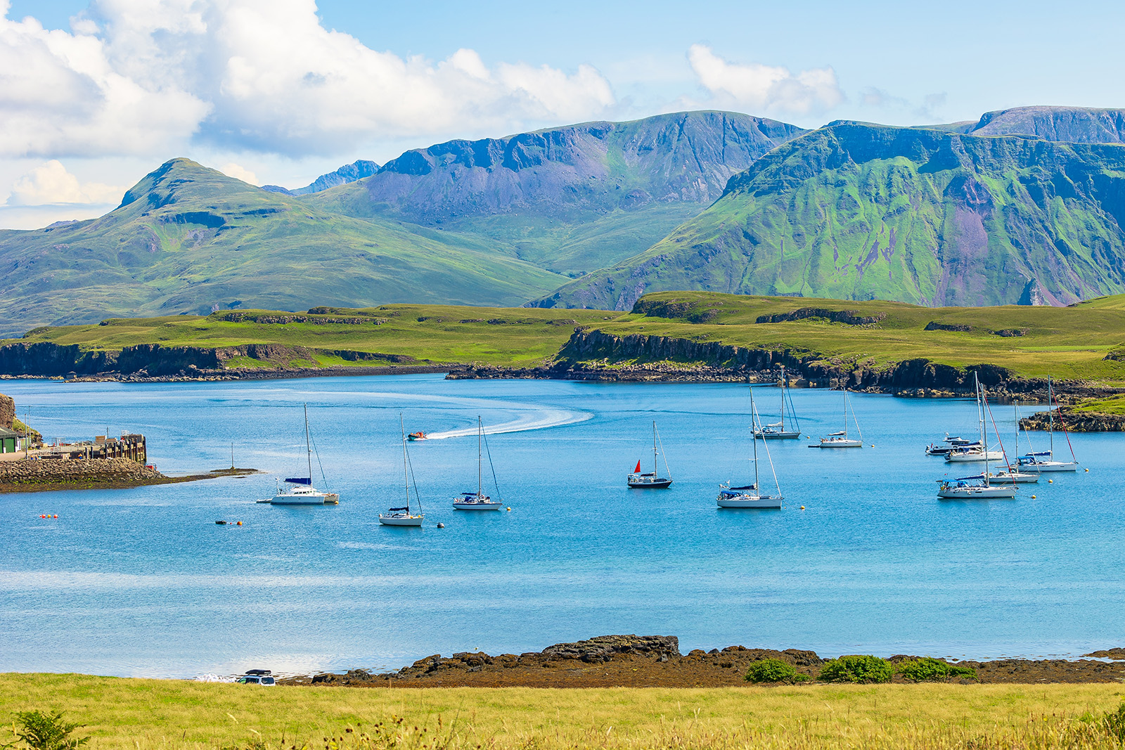 Multiple boats floating in a large lake