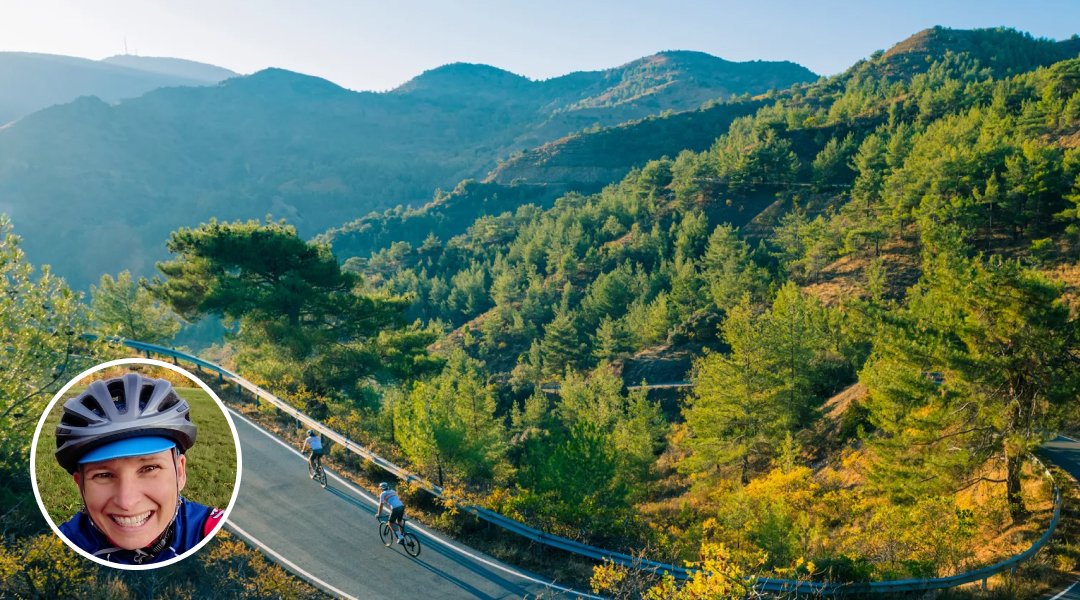cyclists riding down tree lined street