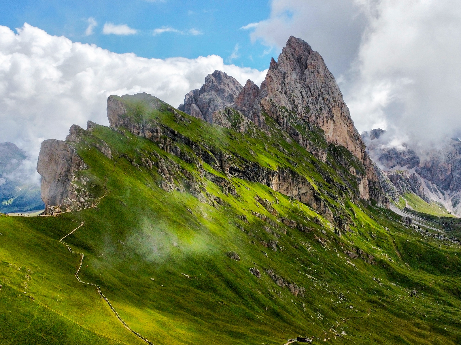 Steep mountain peaks covered in grass
