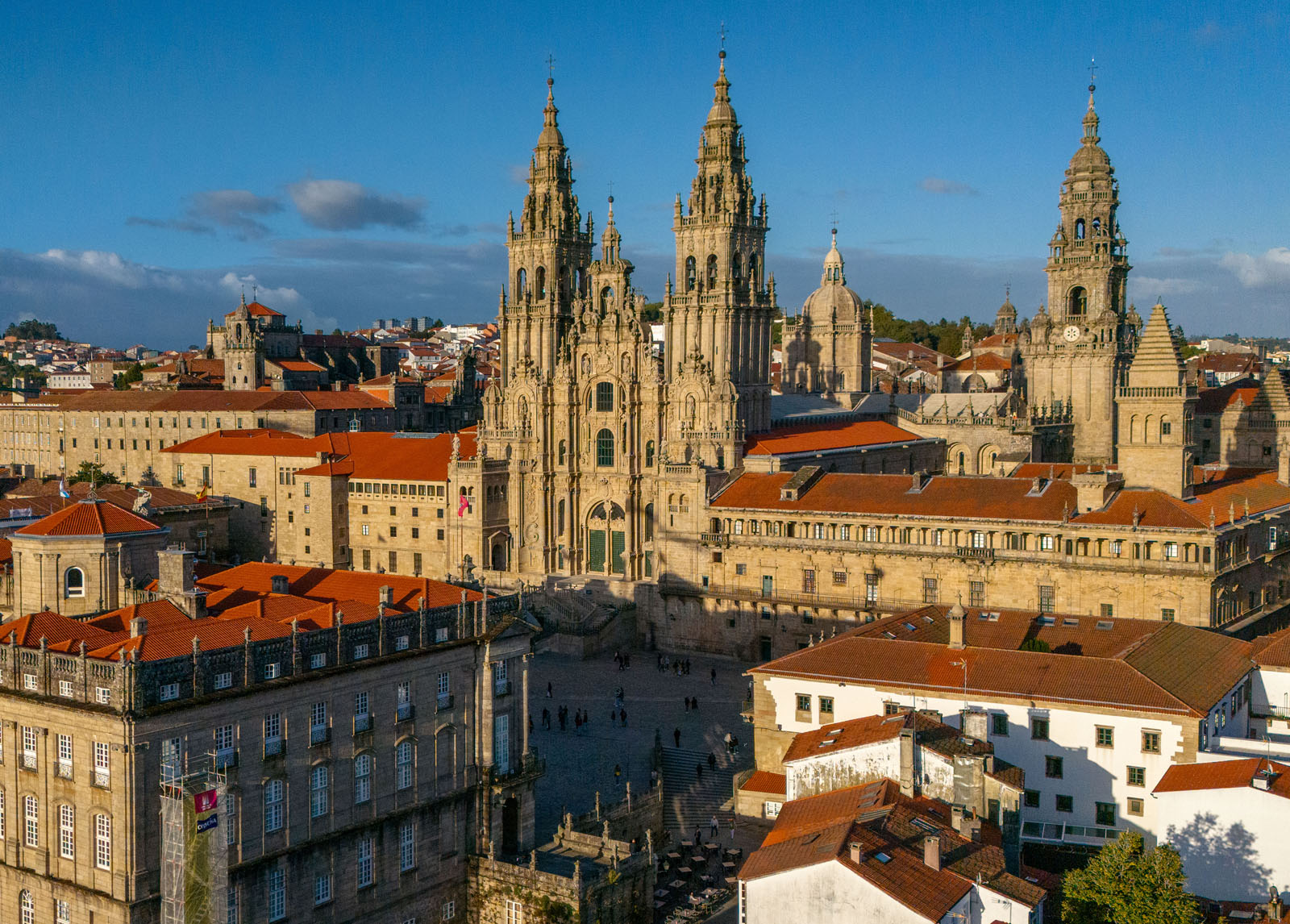 Exterior view of large castle-like building in the middle of a town square