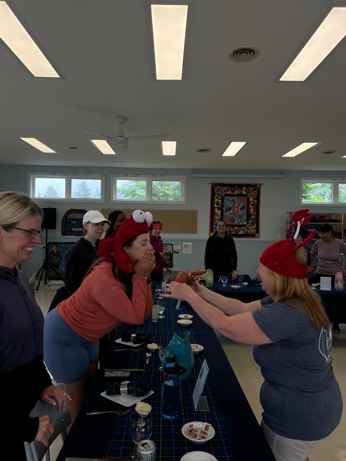 Woman blowing a kiss to a lobster