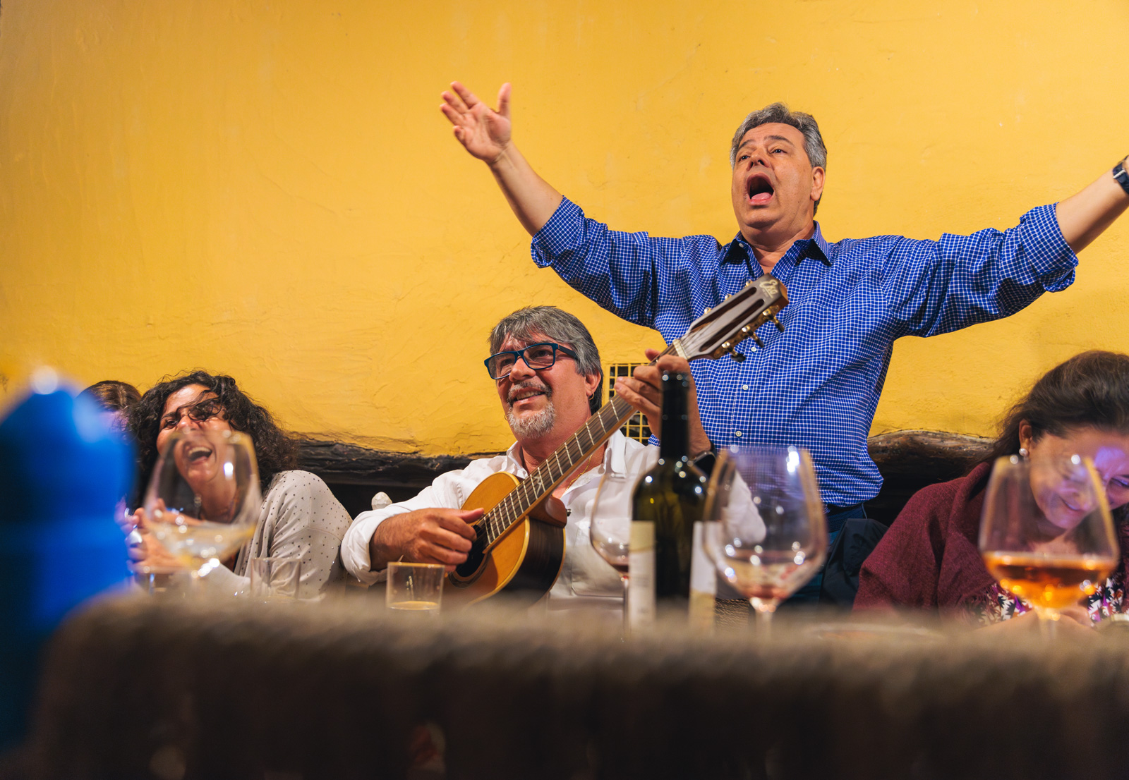 Man singing with his arms open