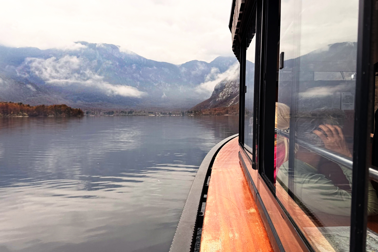 Side view of a boat floating in a large lake