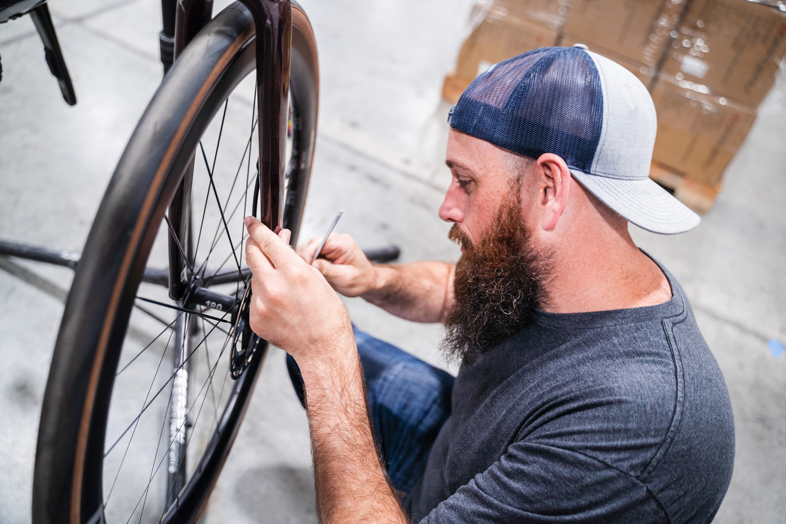 Man fixing a bicycle's back tire