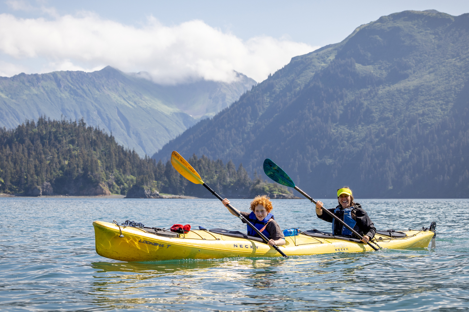 Mother and son kayaking in Alaska.