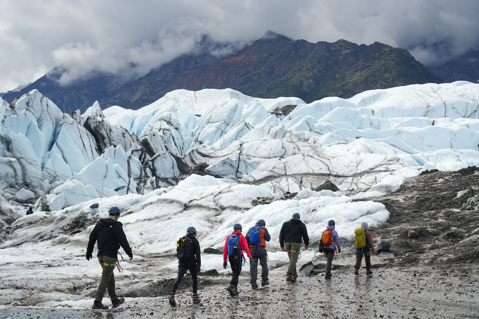 A group of guests ice walk the starkly beautiful landscape of Matanuska Glacier.’