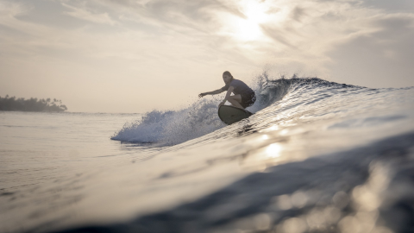 Image of a trip prep specialist surfing