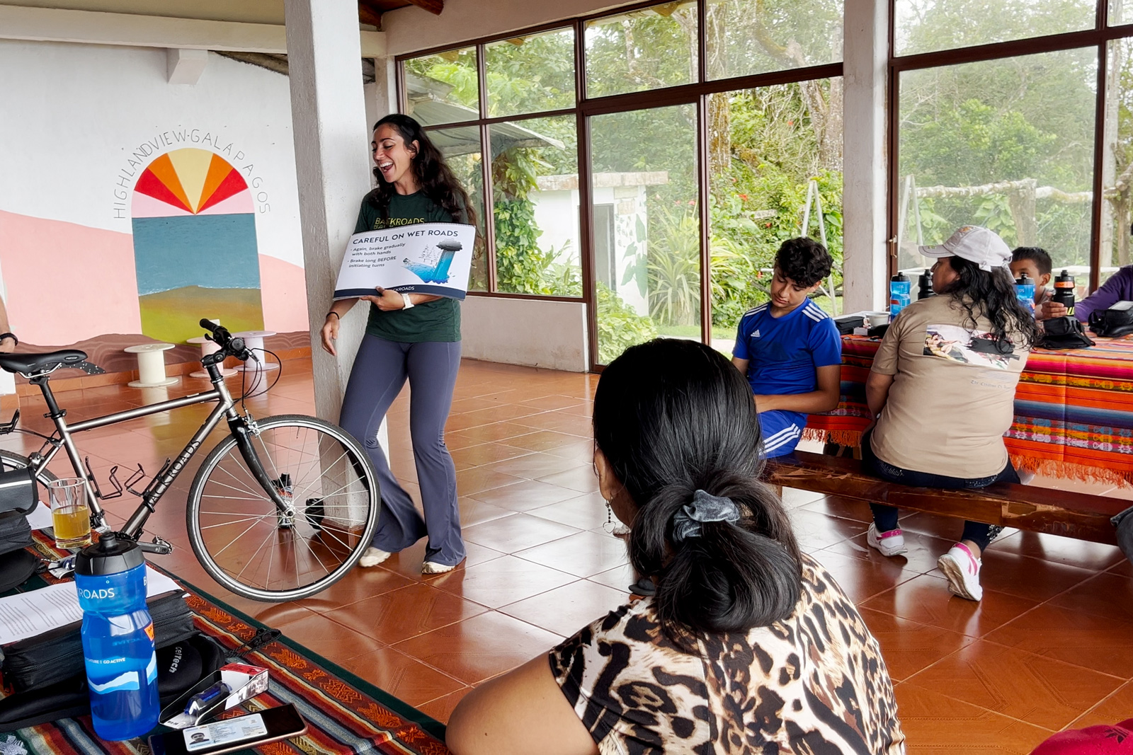Woman with a board showing it to a group of people
