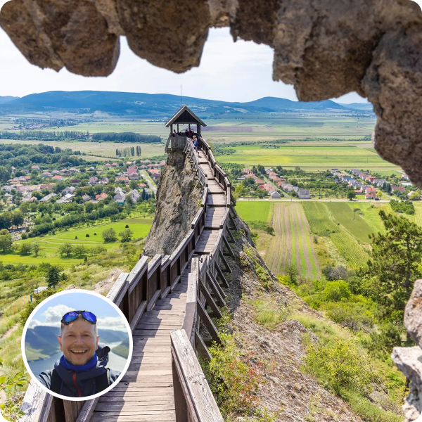 Stone road through green fields