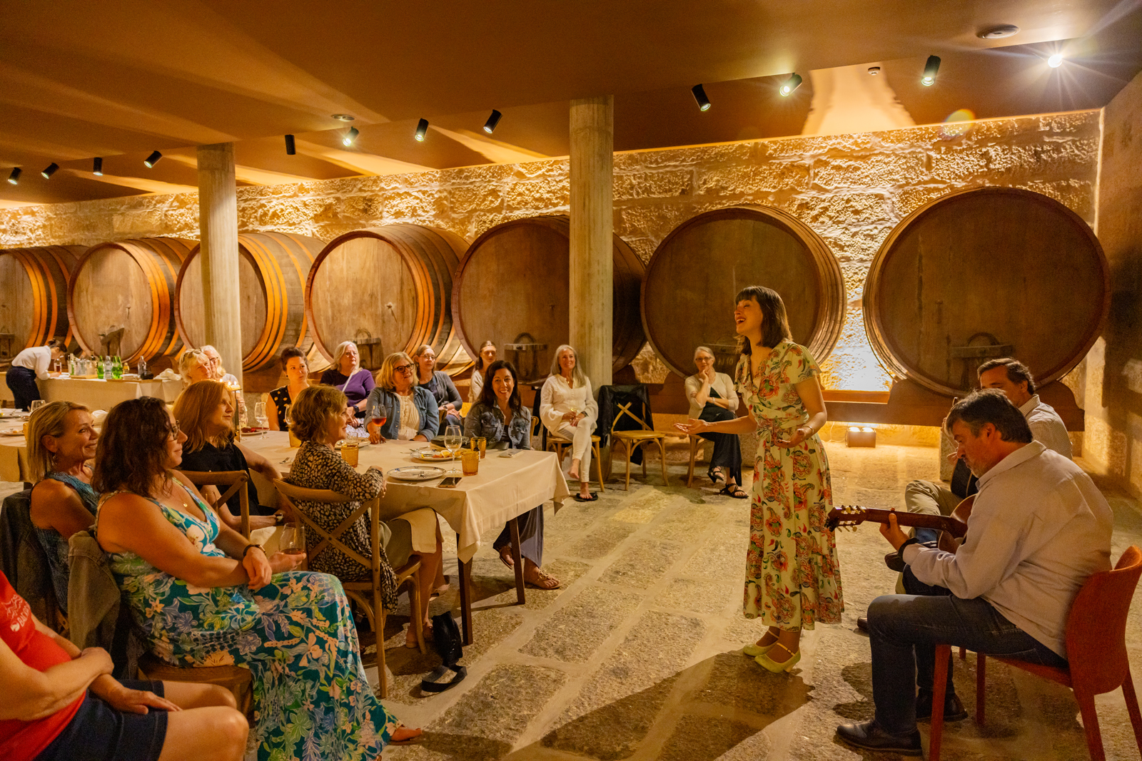 Woman singing in front a crowd of people